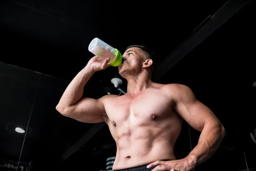 Weight lifter drinking a BCAA product