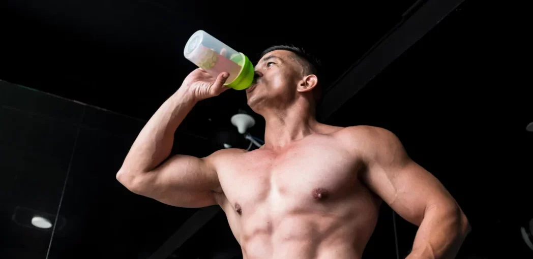 Weight lifter drinking a BCAA product