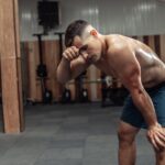 Athletic man exhausted after hard workout